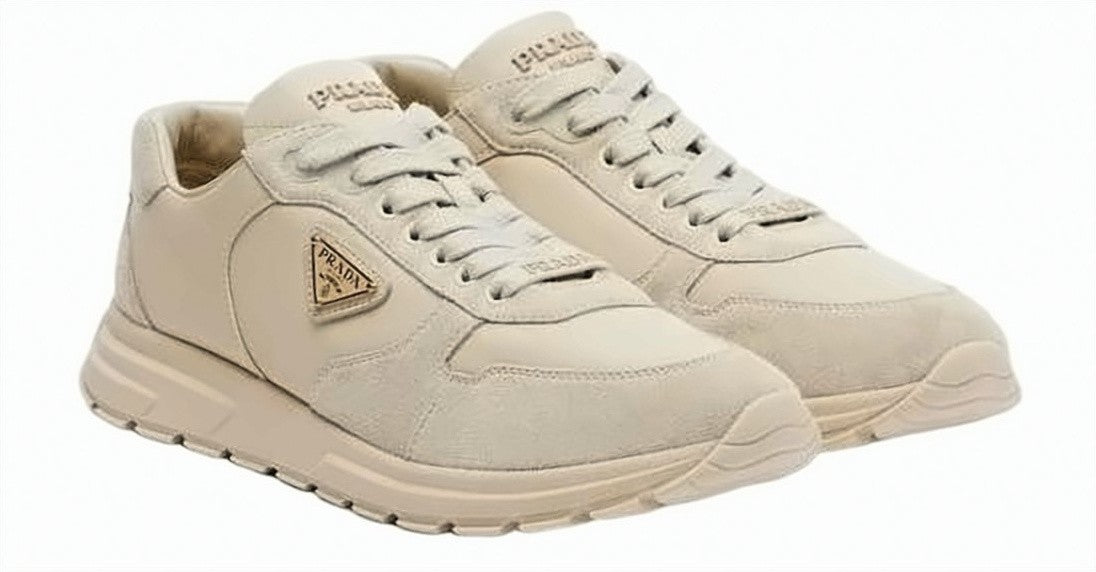 Prada Chunky Beige Sneakers With Textured Accents And Triangular Logo