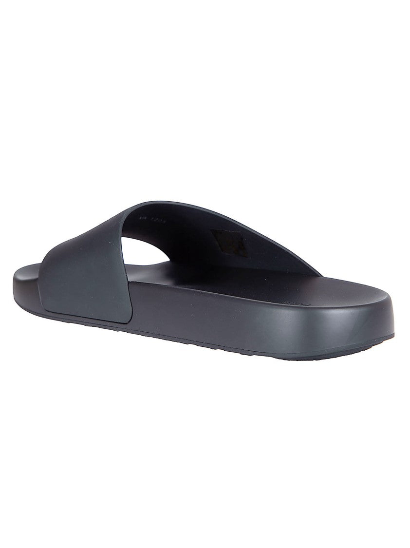 Givenchy Asymmetrical Black Rubber Slides With Embossed Logo