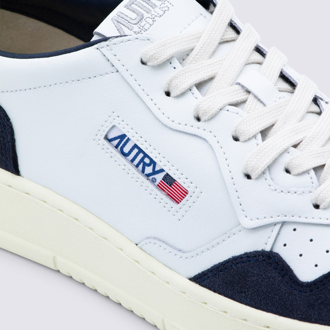 Autry Low-Top Sneakers With Navy Suede Overlays And Stitched Logo