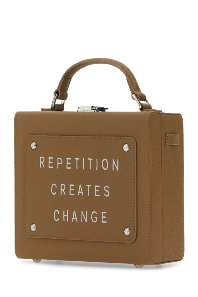 Meli Melo Structured Leather Handbag With Inspirational Embossing