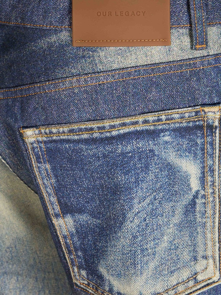 Our Legacy Mid-Wash Denim Jeans With Classic Five-Pocket Design And Distressed Details