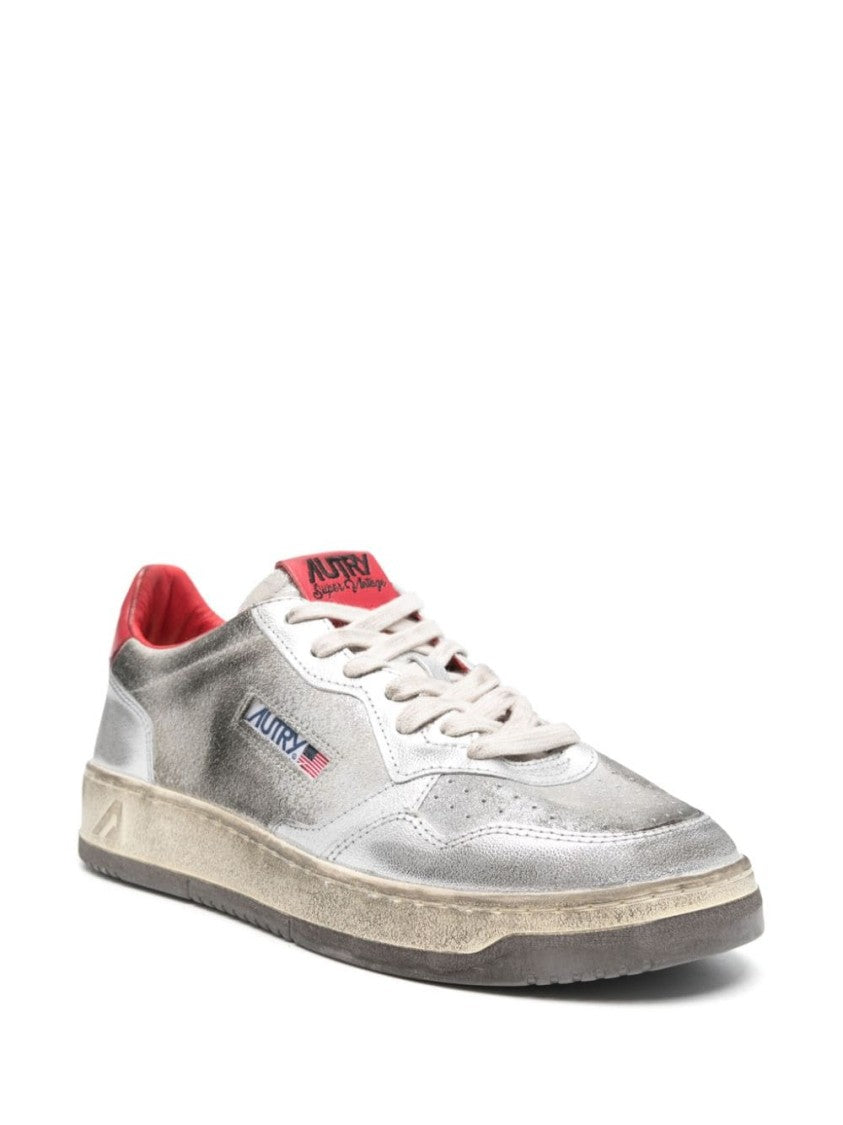 Autry Metallic Silver Sneakers With Textured Finish And Contrasting Red Accents
