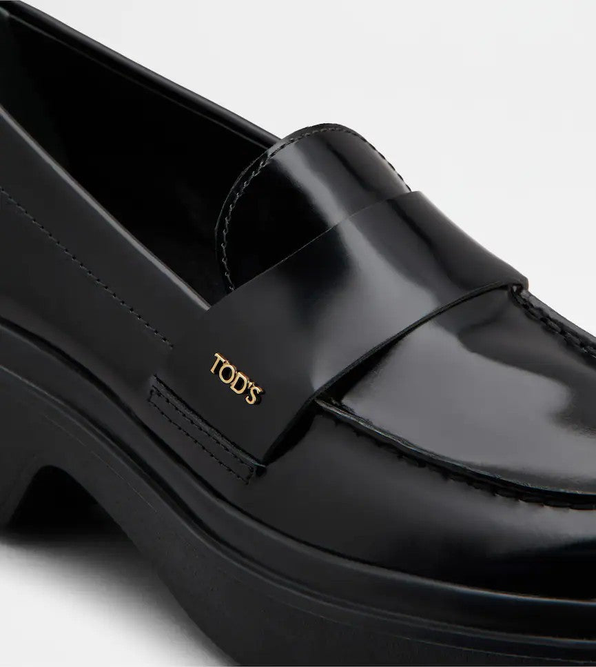 Tod's Timeless Black Calfskin Loafers With Textured Sole