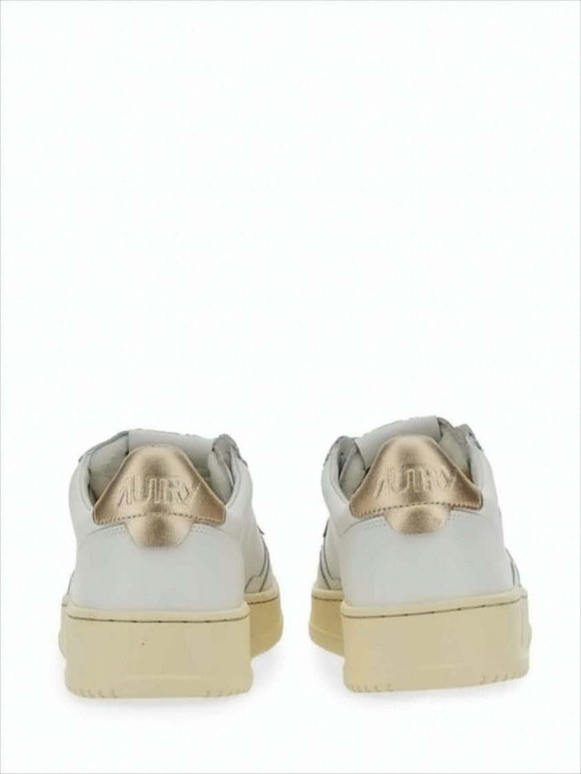 Autry Low-Top White Sneakers With Perforated Detailing And Metallic Accents