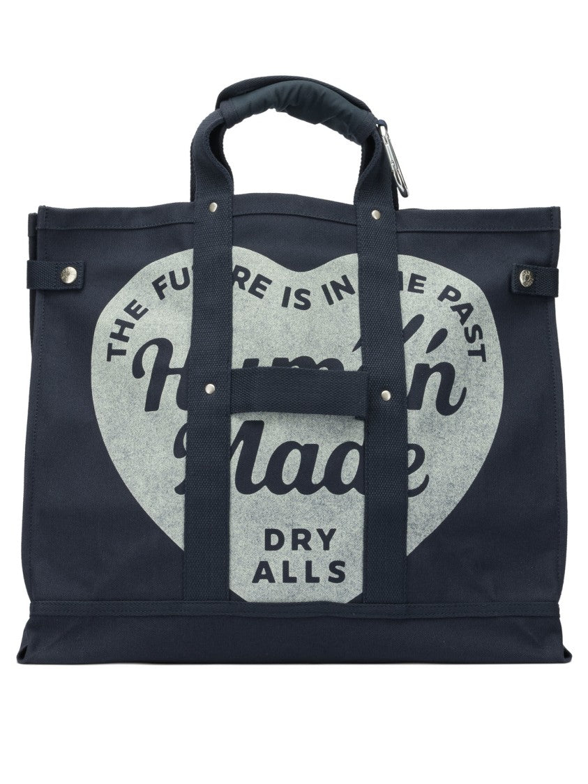 Human Made Durable Canvas Travel Bag With Heart Motif And Integrated Pocket