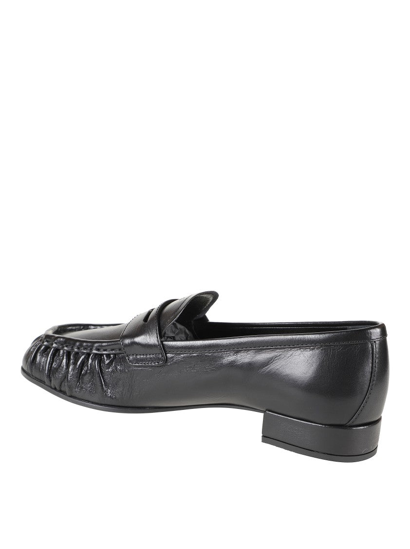Prada Rounded Toe Loafers With Textured Detailing And Low Block Heel