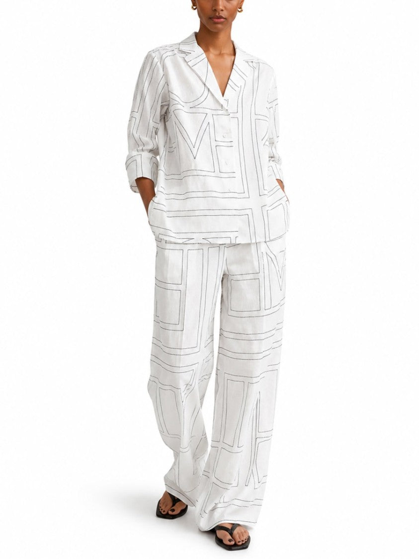 Totême Wide-Leg Pants With Subtle Monogram And Relaxed Fit