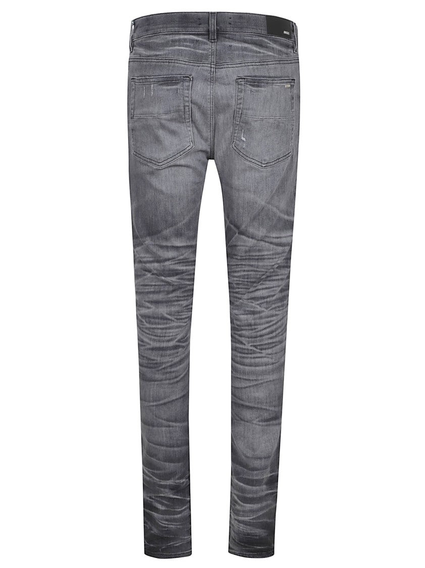 Amiri Distressed Grey Denim Jeans With Ripped Details