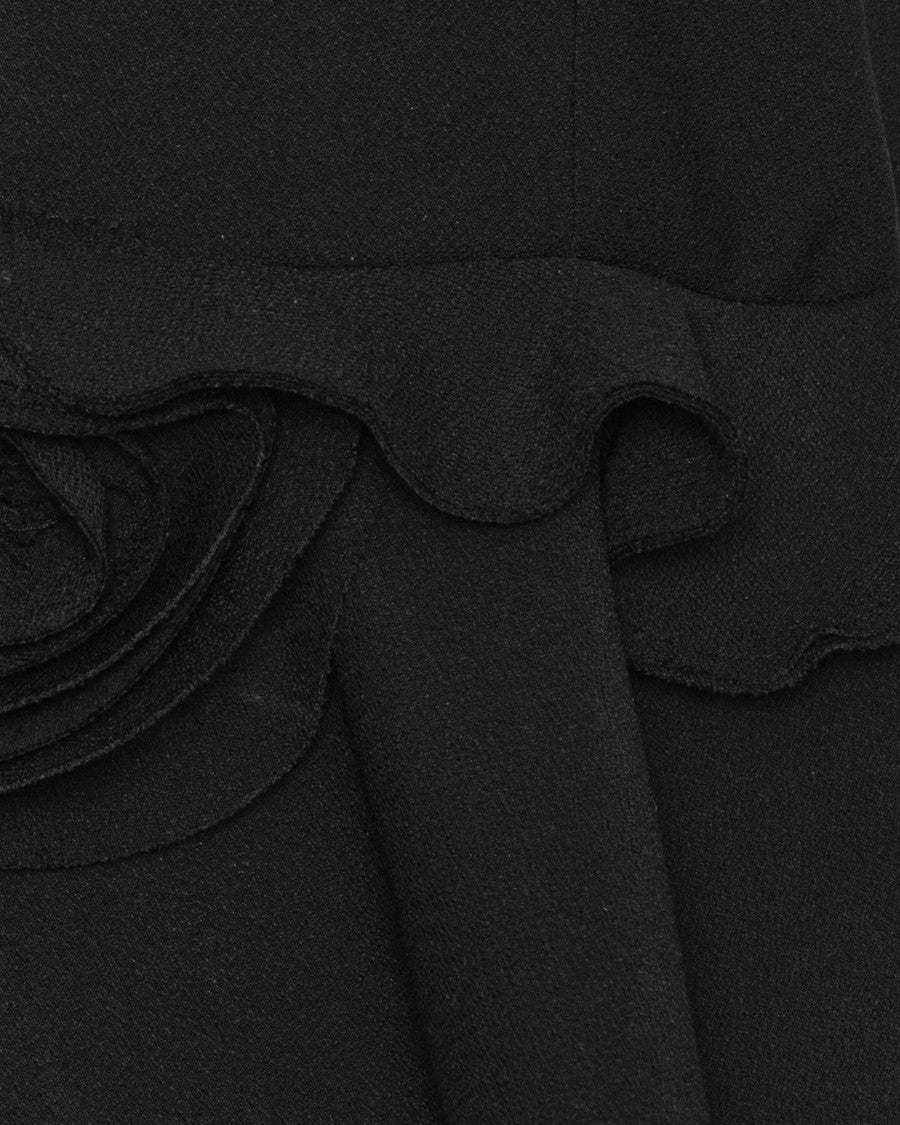 Rotate Sleeveless Black Peplum Top With Decorative Flower