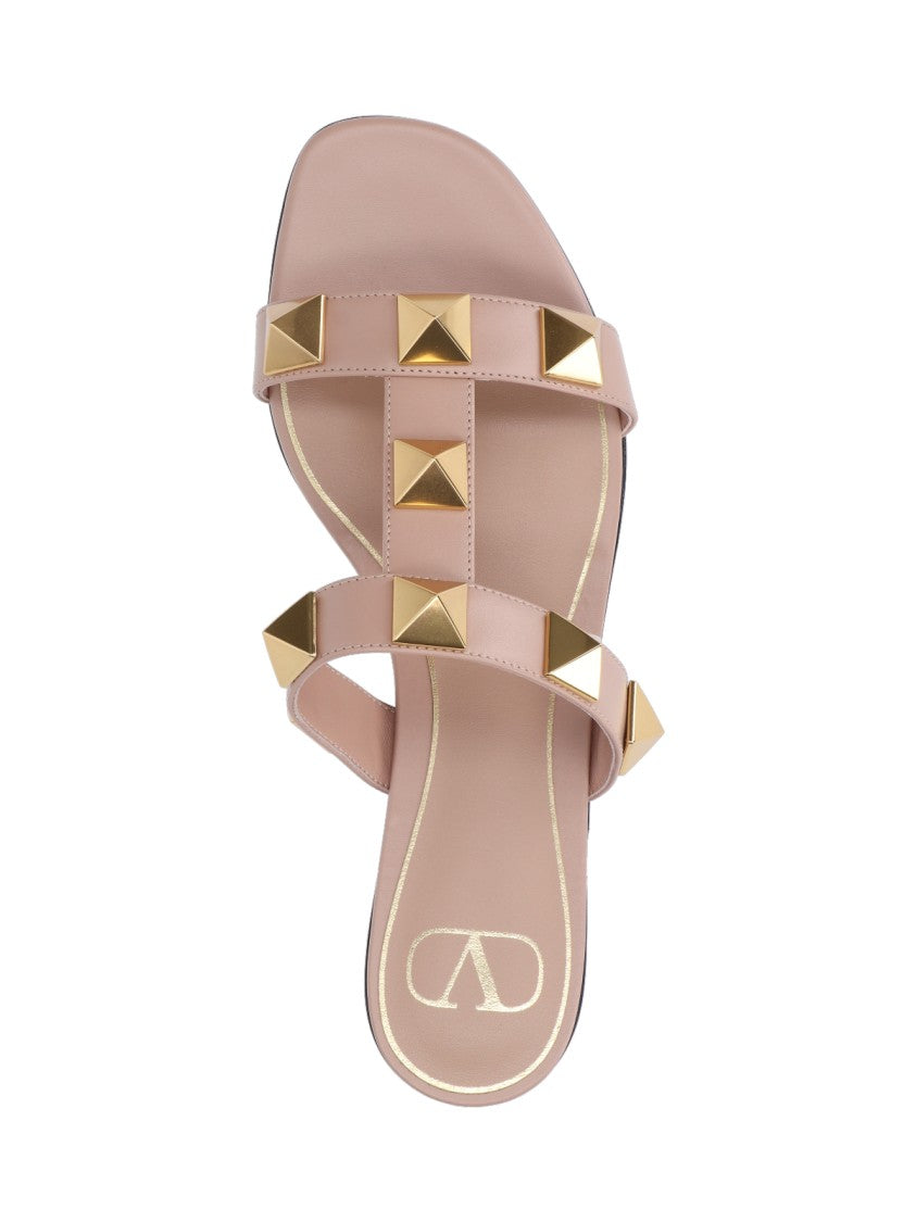 Valentino Garavani Minimalist Pink Flat Sandals With Pyramid Gold Studs