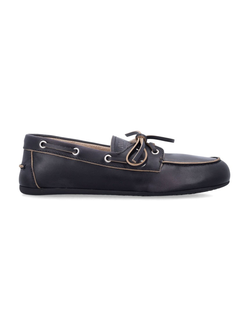 Miu Miu Leather Boat Loafers With Bow-Embossed Logo
