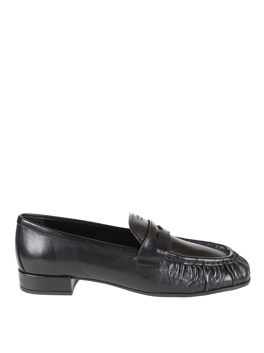 Prada Rounded Toe Loafers With Textured Detailing And Low Block Heel