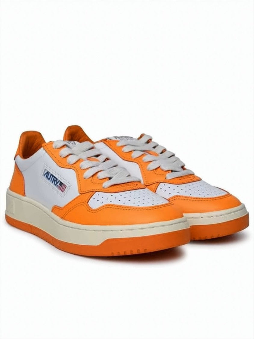 Autry Low-Top Sneakers With Vibrant Orange Overlays And Perforated Detailing
