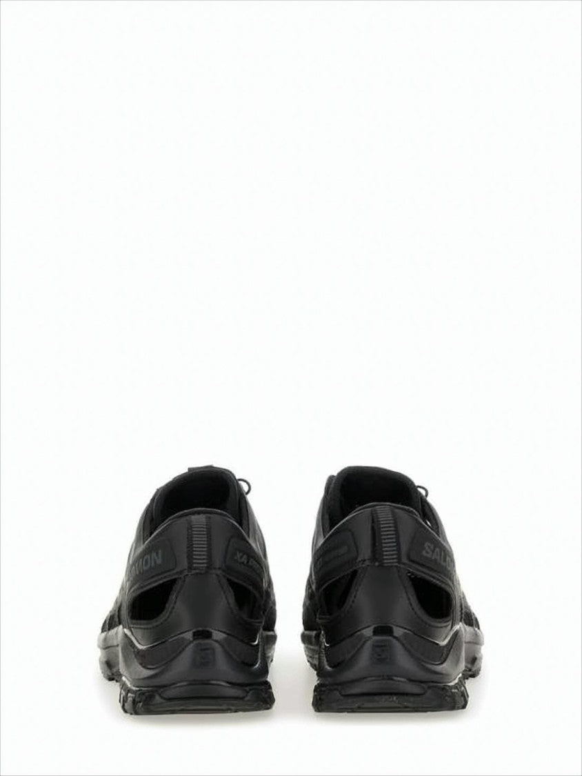 Salomon All-Black Athletic Sneakers With Quick-Pull Lacing System