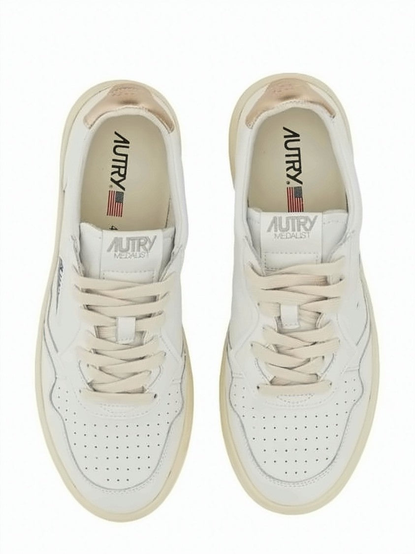 Autry Low-Top Leather Sneakers With Perforated Detailing And Metallic Accents