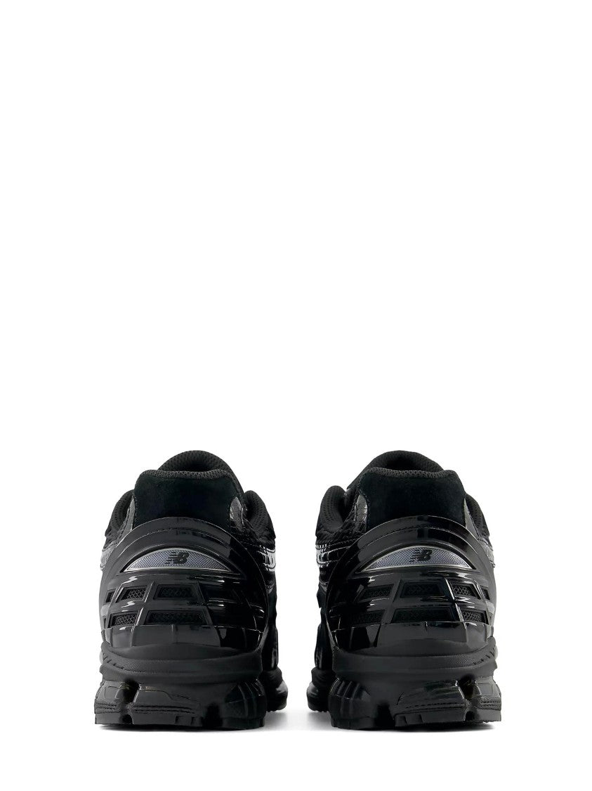 New Balance Textured All-Black Sneakers With Cushioned Sole And Iconic Branding