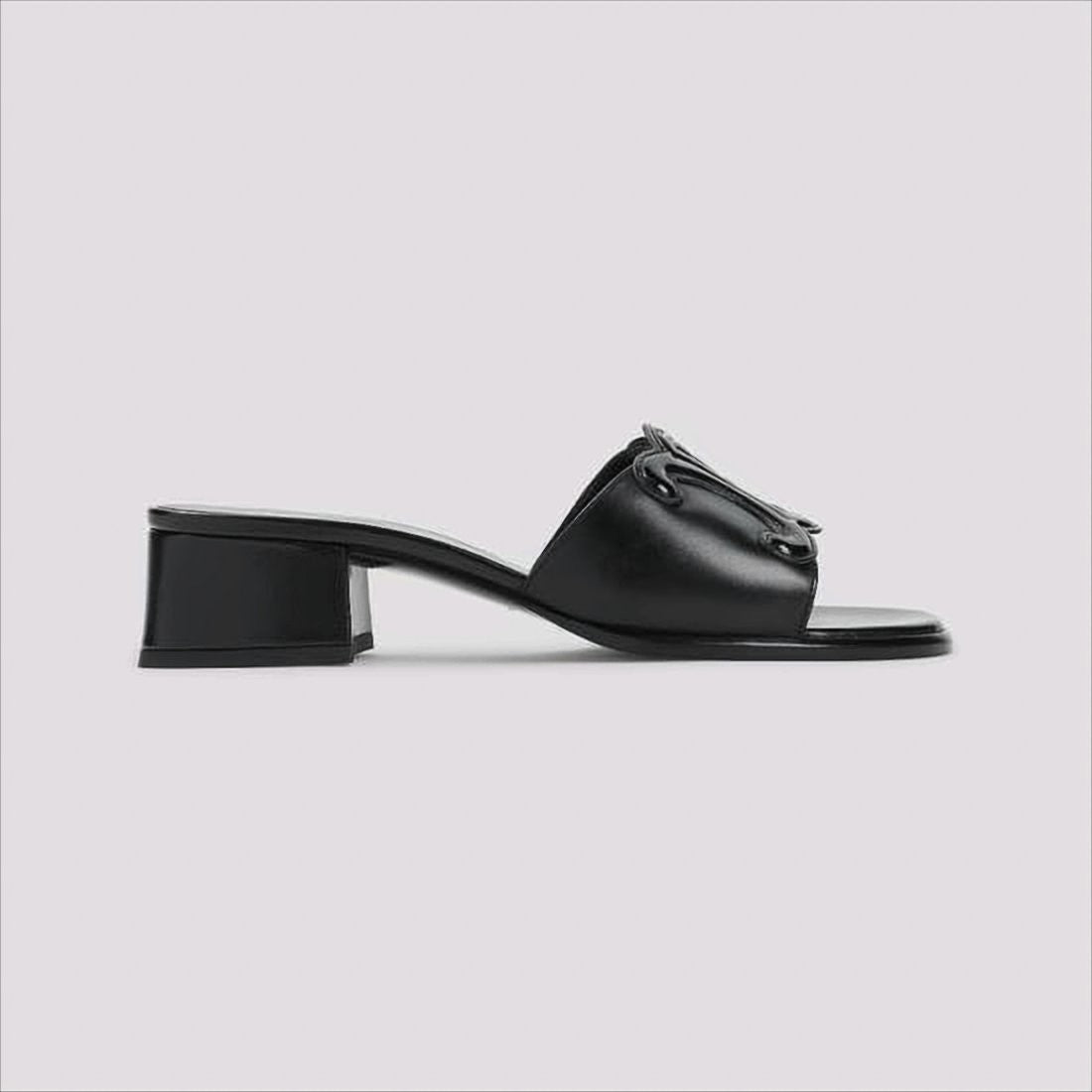 Celine Open Toe Mules With Glossy Emblem Detail