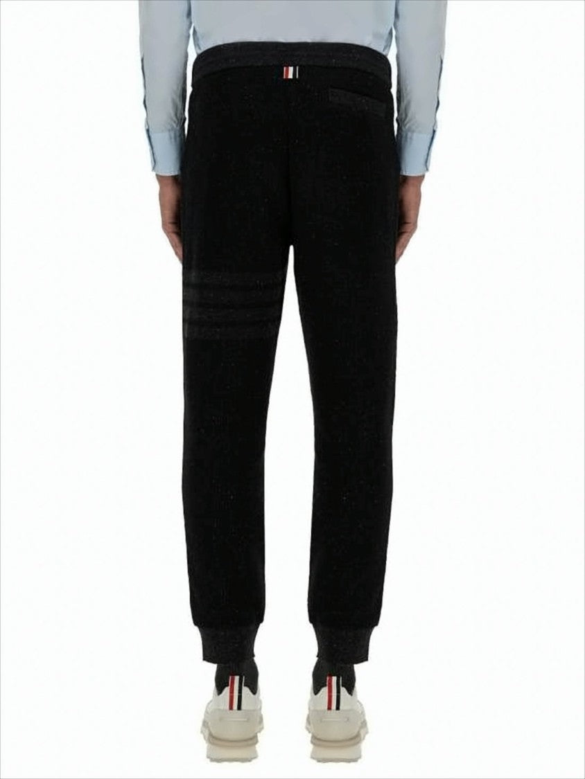 Thom Browne Tapered Jogger Pants With Ribbed Cuffs And Subtle Stripes