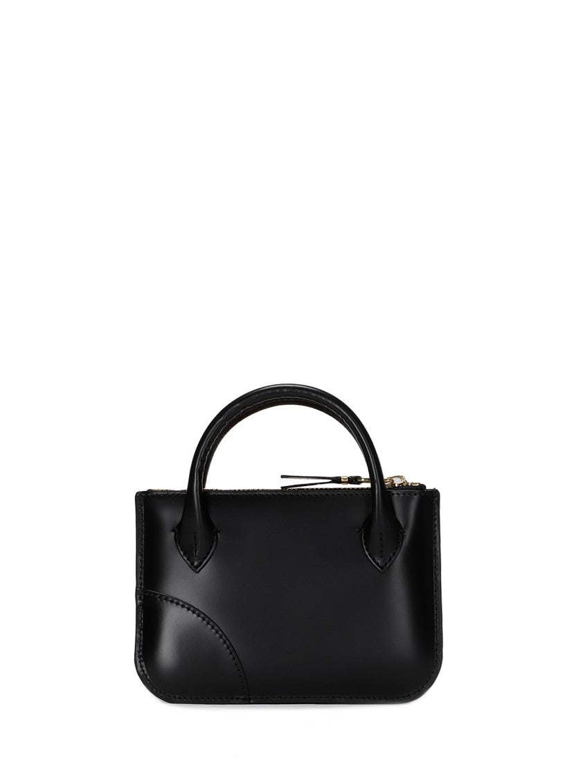 Comme Des Garçons Brown Cowhide Leather Handles With Minimalistic Design