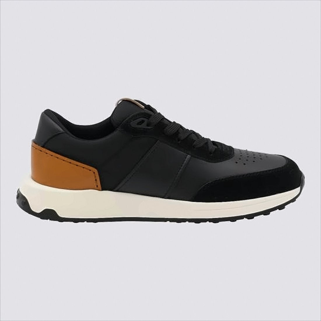 Tod's Black Leather Sneakers With Perforated Detailing And Tan Heel Patch