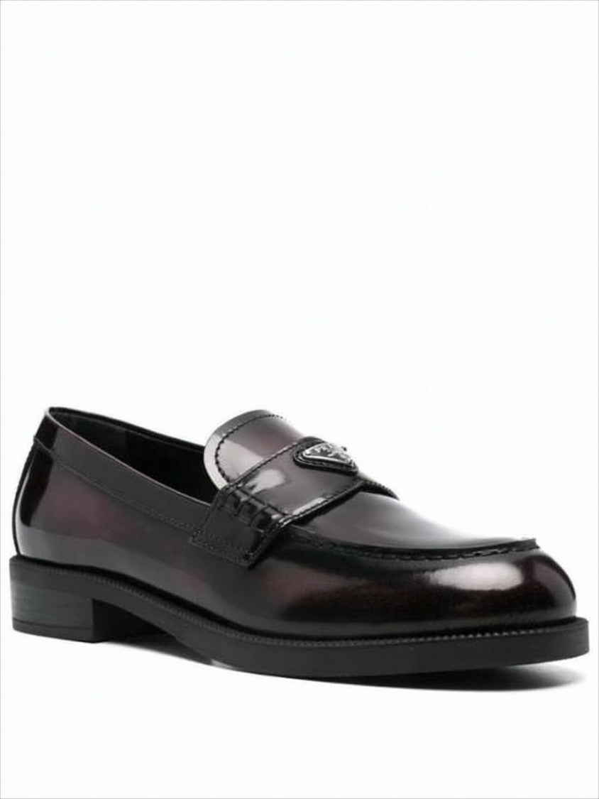 Prada Polished Leather Loafer With Metallic Emblem Detail
