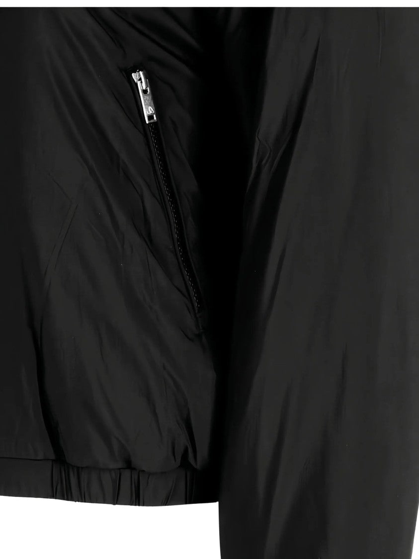 Moose Knuckles Cropped Black Faux Fur Jacket With Plush Hood And Zippered Pockets