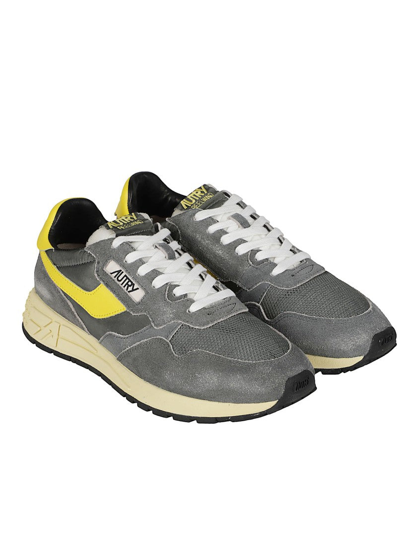 Autry Low-Top Sneakers With Textured Grey Upper And Bold Yellow Accents