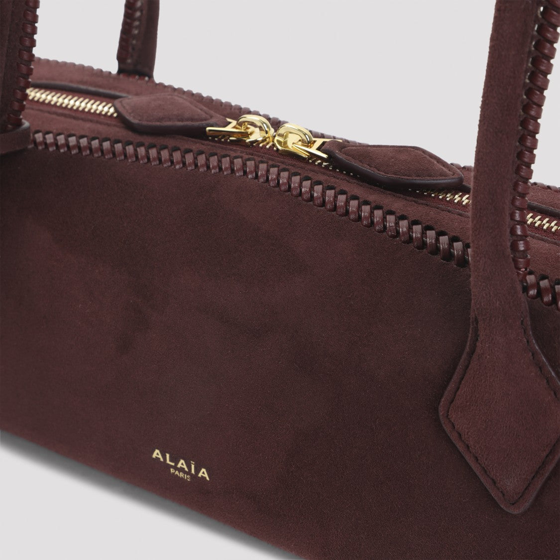Alaïa Elongated Red Suede Handbag With Gold-Tone Accents