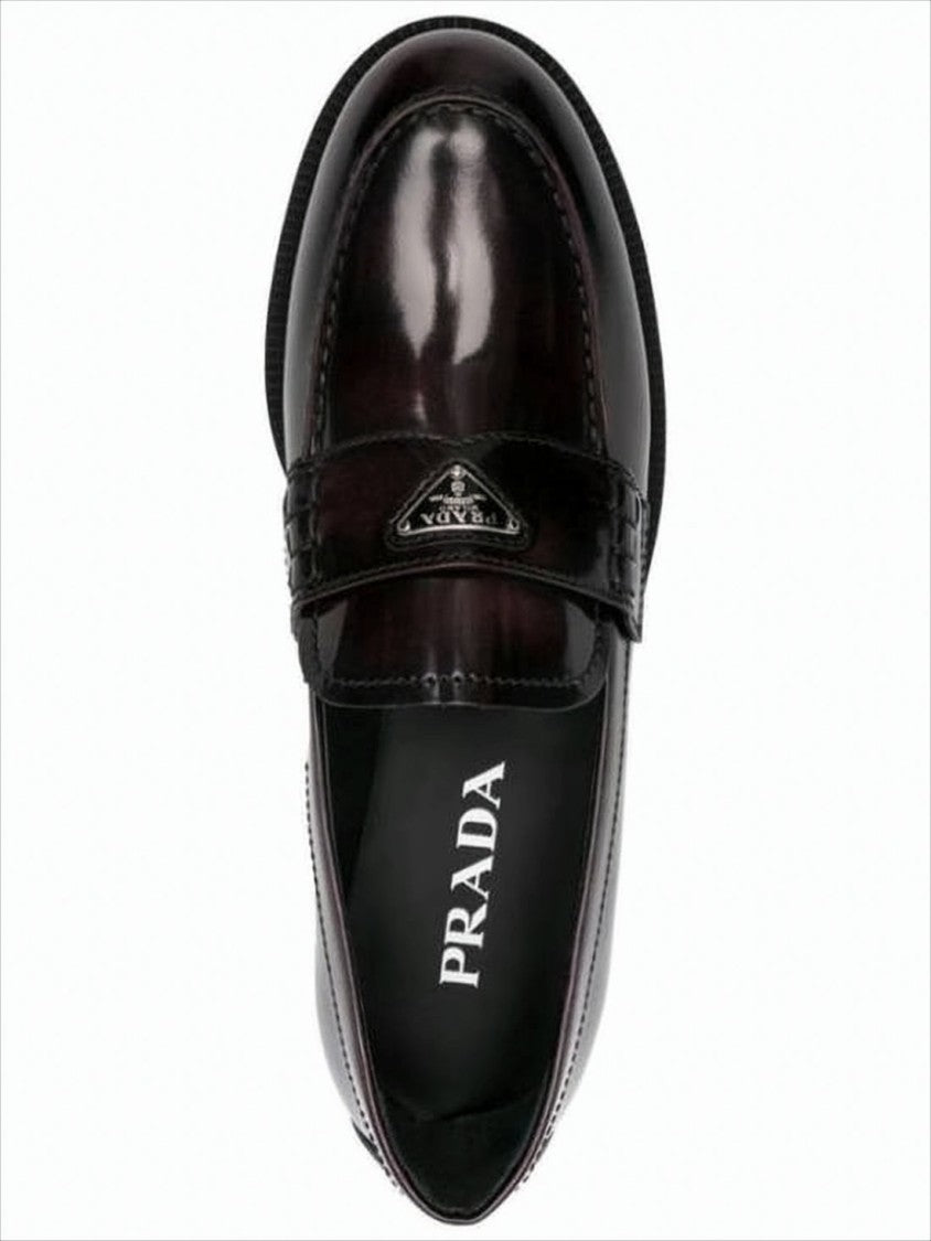 Prada Polished Leather Loafer With Metallic Emblem Detail