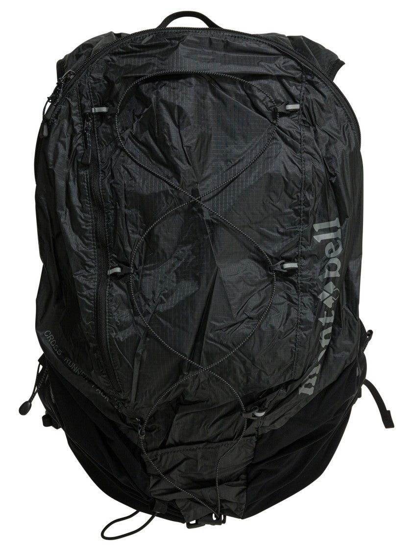 Montbell Versatile Black Backpack With Adjustable Straps And Utility Features