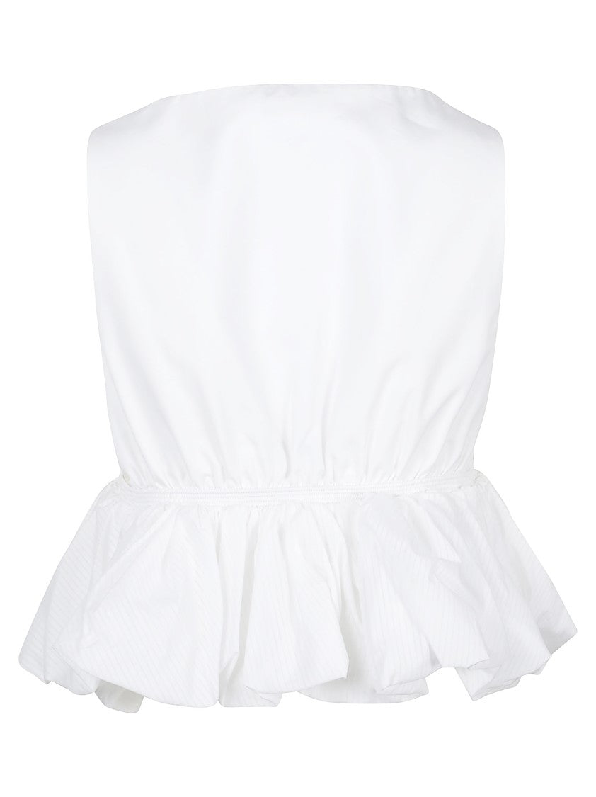 Alaïa Cropped Peplum Top With Deep V-Neck And Ruffled Hem
