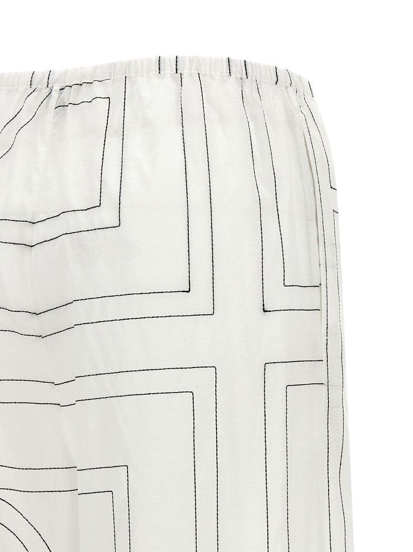 Totême Wide Leg Pajama-Style Pants With Monogram Embroidery