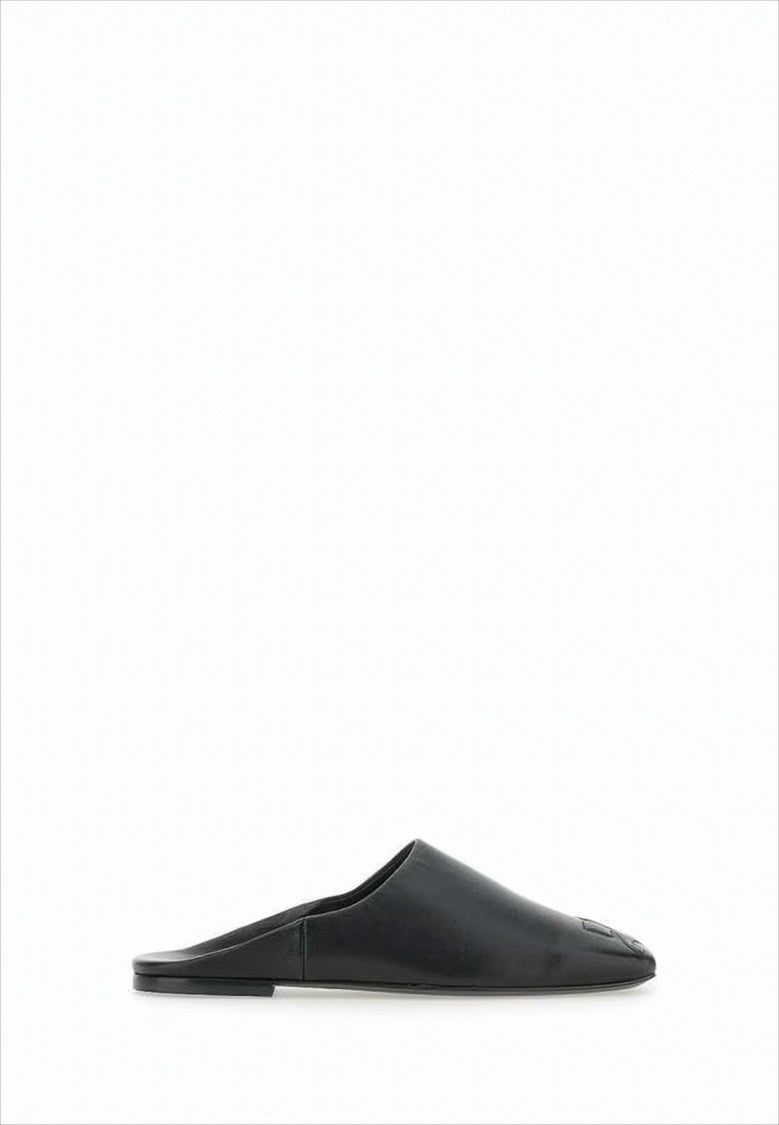 Courrèges Minimalist Black Lambskin Slip-On Mules With Embossed Detail