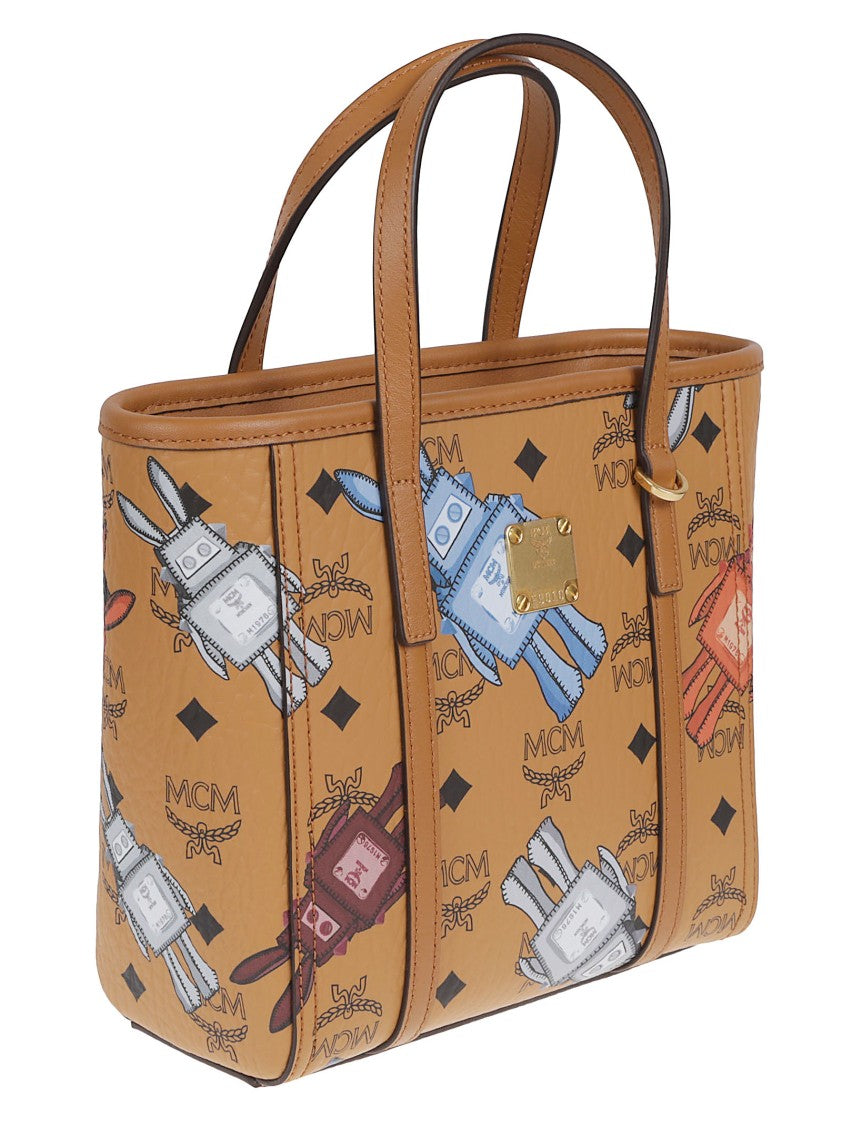 Mcm Coated Canvas Handbag With Playful Logo Print And Leather Accents