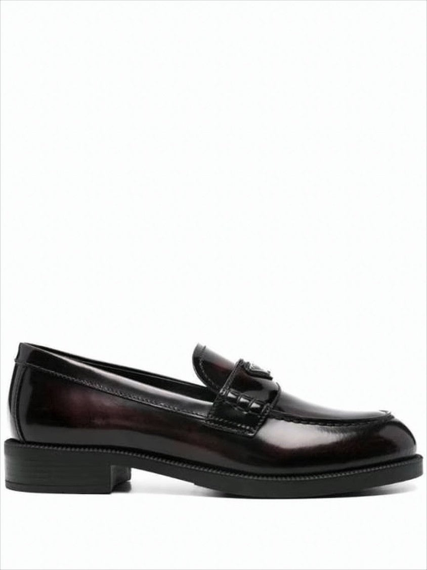 Prada Polished Leather Loafer With Metallic Emblem Detail