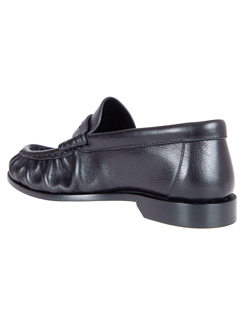 Saint Laurent Hand-Stitched Moccasin-Style Flats With Bronze Detailing