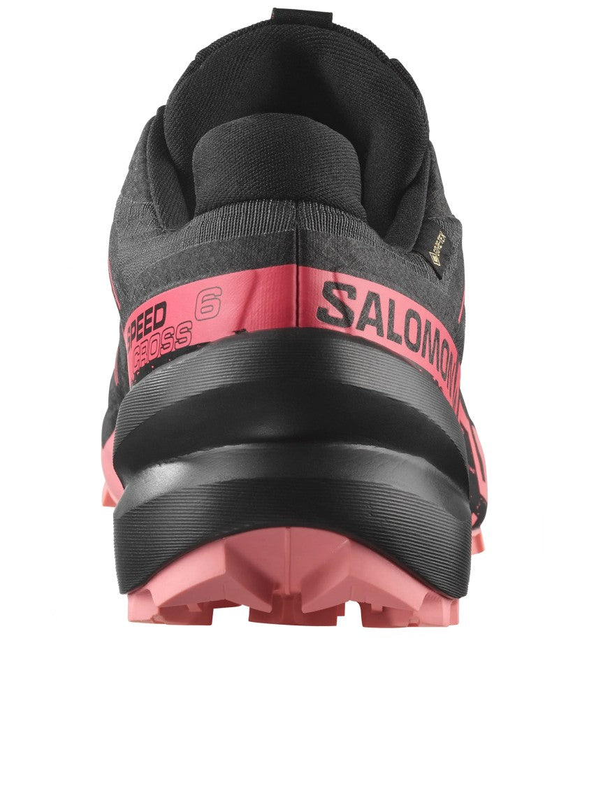 Salomon Streamlined Black Athletic Sneakers With Vibrant Pink Accents