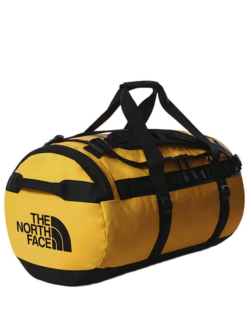 The North Face Cylindrical Yellow Duffel Bag With Black Accents