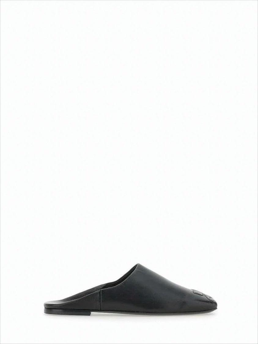 Courrèges Minimalist Black Lambskin Slip-On Mules With Embossed Detail