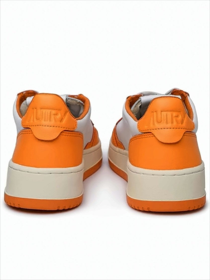 Autry Low-Top Sneakers With Vibrant Orange Overlays And Perforated Detailing