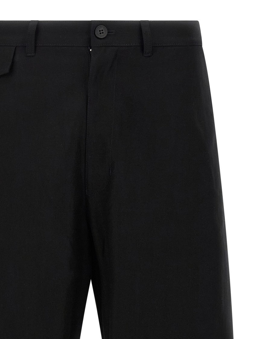 Comme Des Garçons Curved Leg Trousers With Knee Pincer Detail And Adjustable Back Strap