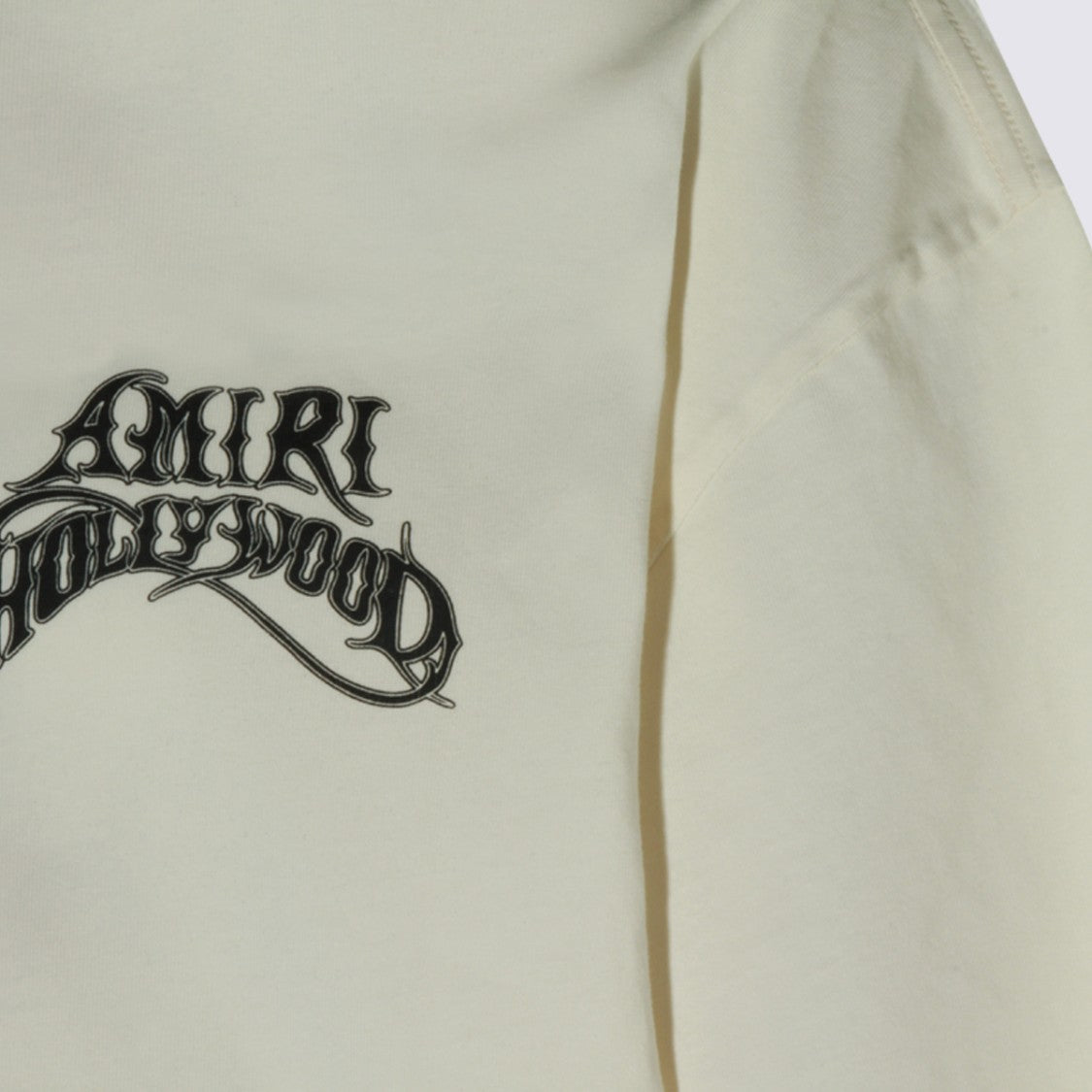 Amiri Light Cream T-Shirt With Bold Graphic Logo Design