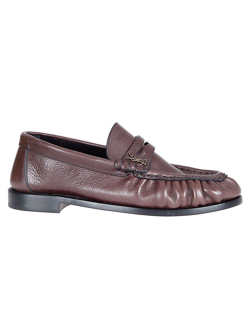 Saint Laurent Moccasin-Style Flat Shoes With Hand-Stitched Detail And Metal Emblem