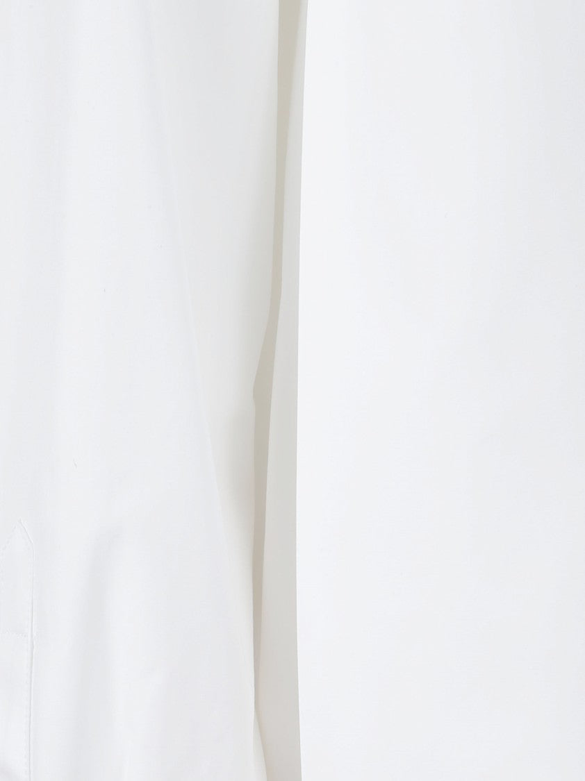Alaïa Textured Popeline Shirt With Asymmetrical Hem And Hidden Closure