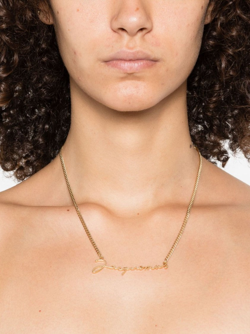 Jacquemus Gold Tone Cursive Logo Pendant Necklace