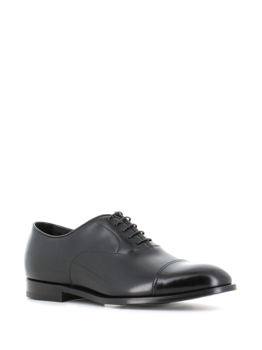 Doucal's Polished Black Oxford Shoes With Subtle Stitching Details