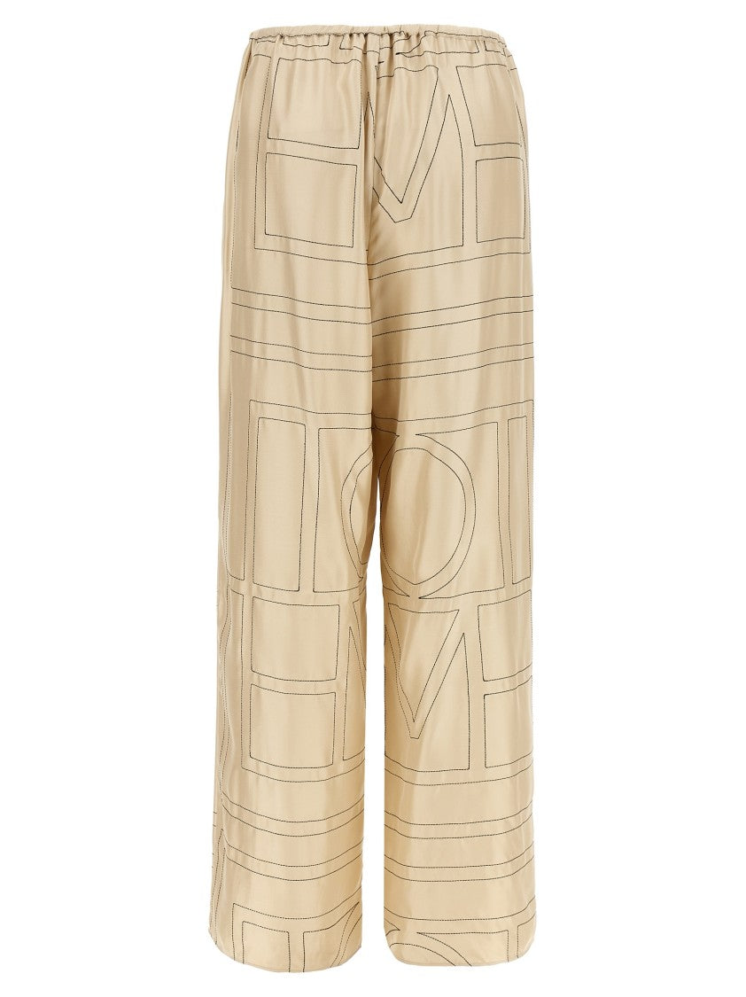 Totême Silk Twill Trousers With Monogram Embroidery