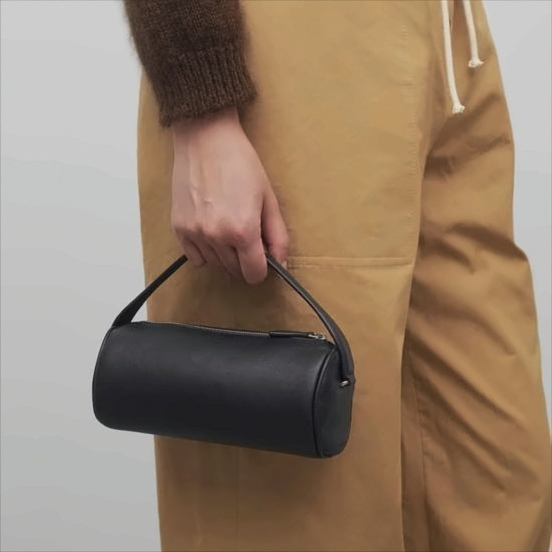 The Row Cylindrical Black Lambskin Clutch With Top Handle