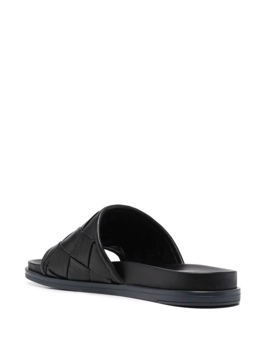 Casadei Minimalist Black Leather Mules With Woven Strap