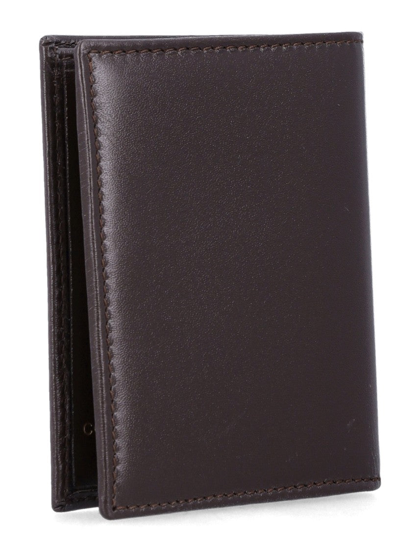 Comme Des Garçons Sleek Leather Bi-Fold Wallet With Gold Logo Accent